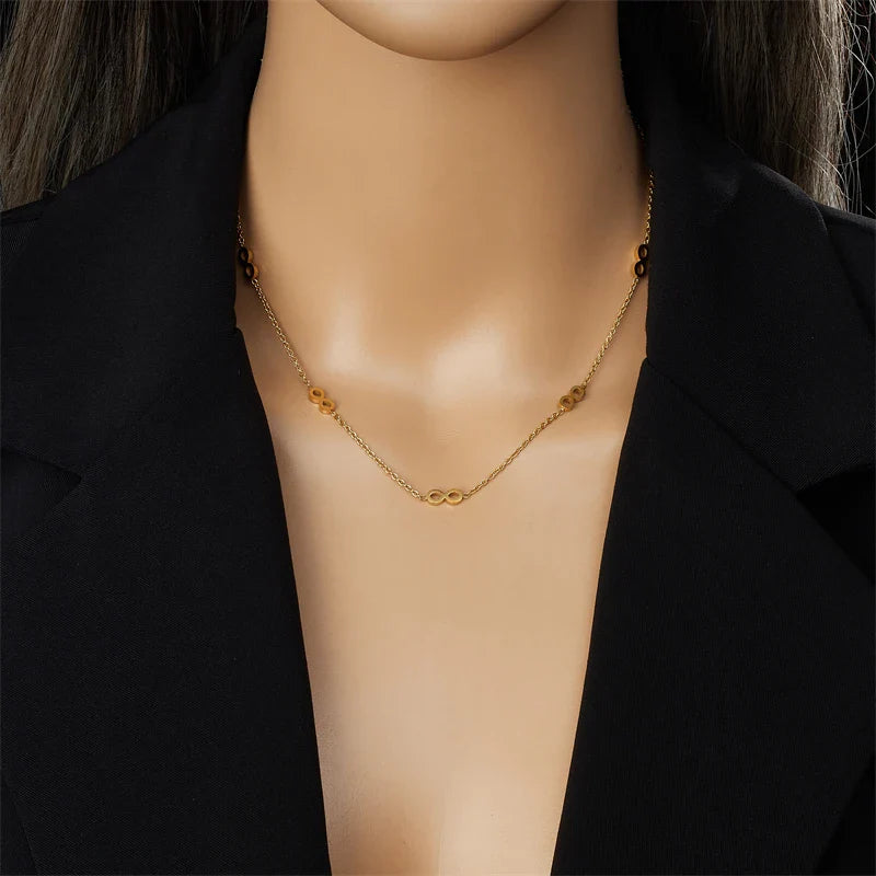 Parure bijoux femme infini doré collier et boucles assorties élégantes