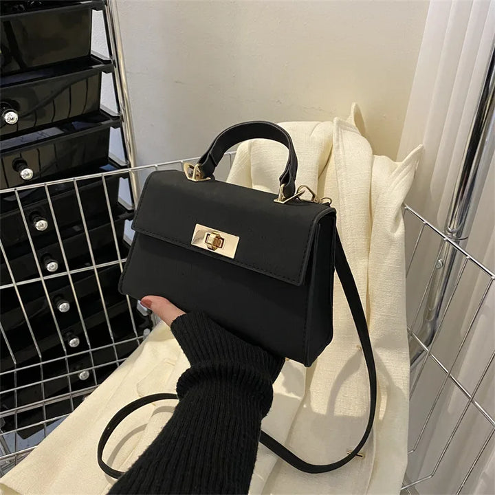 Sac satchel femme structuré fermoir twist-lock bandoulière amovible