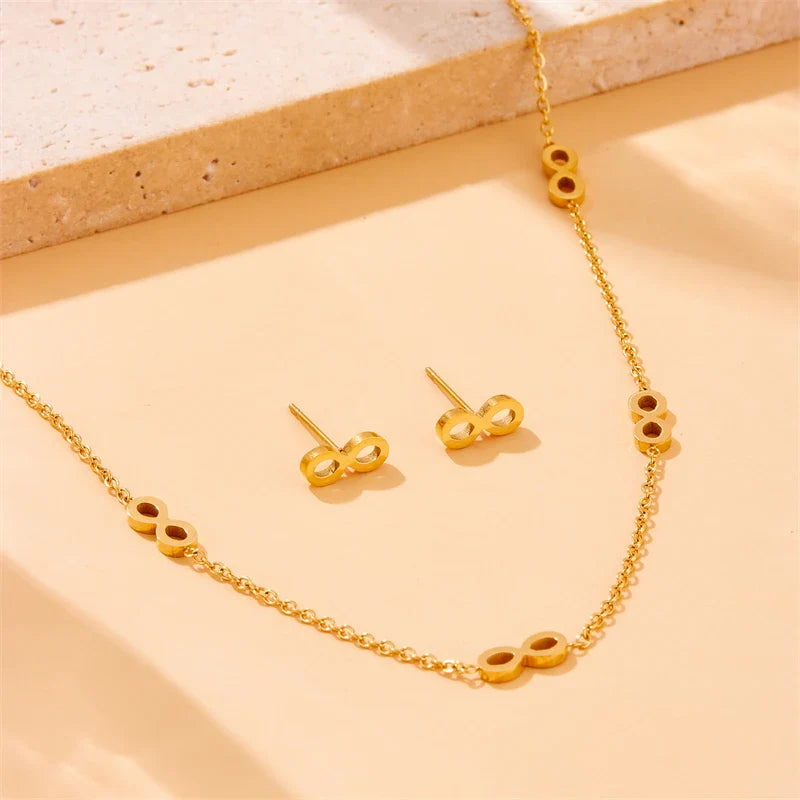 Parure bijoux femme infini doré collier et boucles assorties élégantes